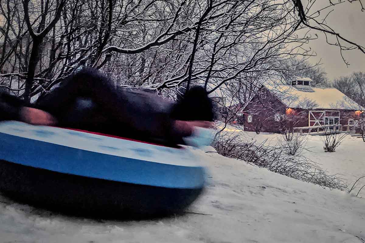 Super Dave Costa flies down the sledding hill at Schmanska Park