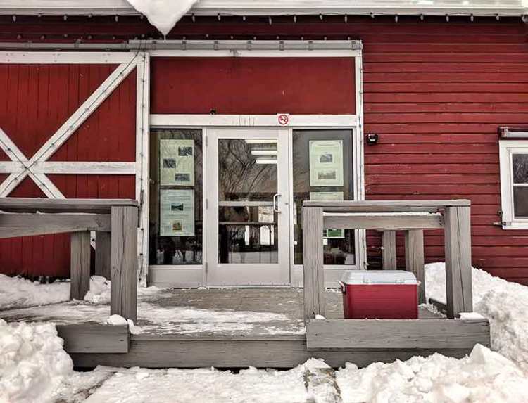 Red cooler for lantern drop off at the Schmanska barn
