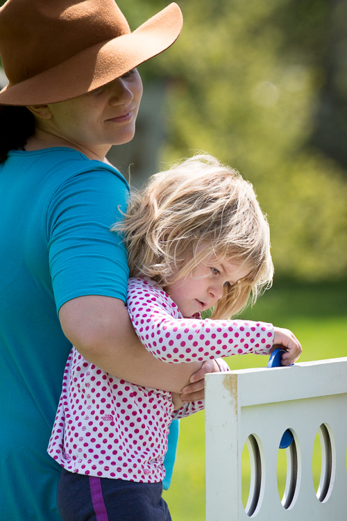 Kid plays connect four outside